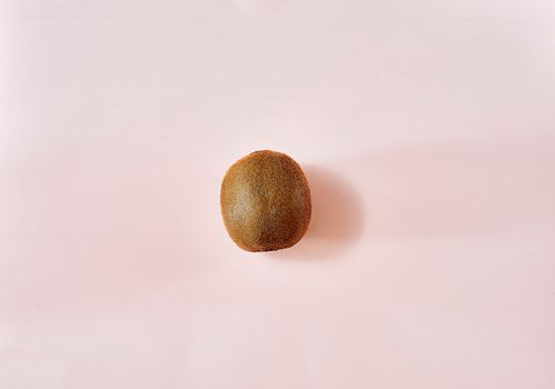 Kiwi in the middle of a white background. unique, bright, clean, empty space.