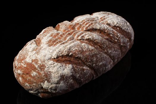 Bread on a dark background.Loaf