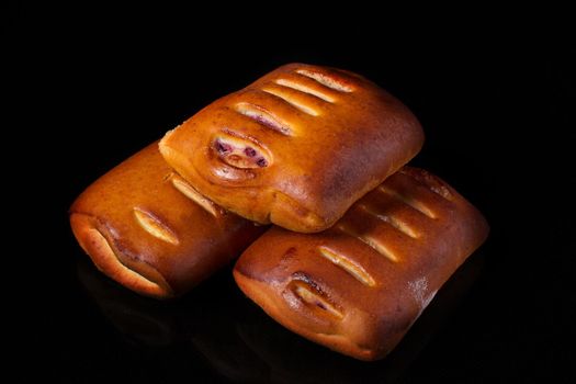 Bun with fruit filling on a dark background