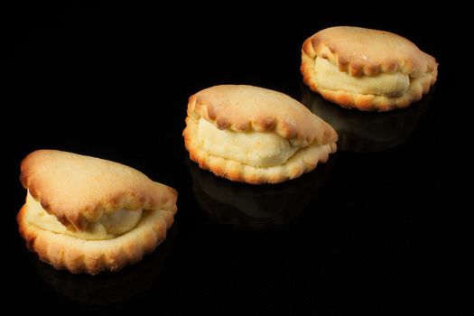 Cookies with cottage cheese on a black background