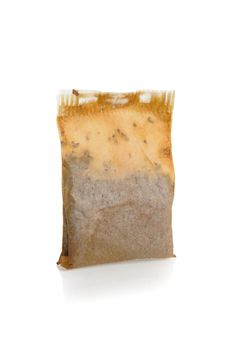 used tea bag isolated on white background