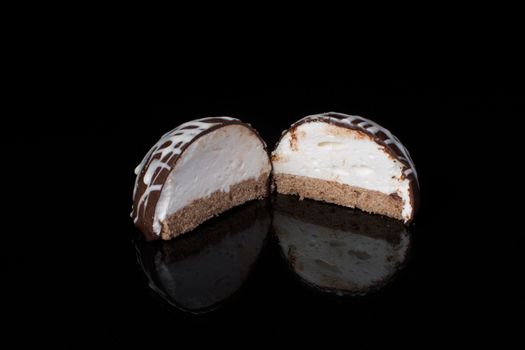 Small chocolate cakes on a black background.Brownie