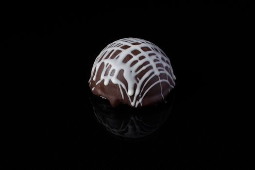 Small chocolate cakes on a black background.Brownie