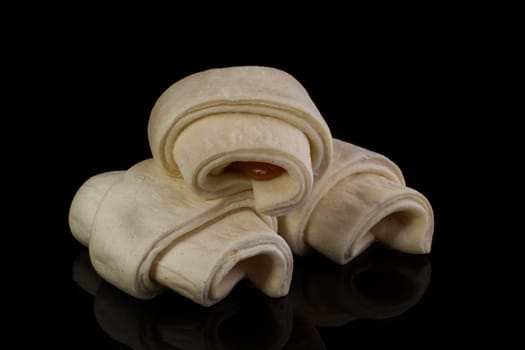 Bundled puff pastry with jam. Billets for baking