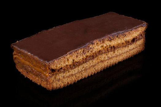 A piece of shortcake with chocolate icing