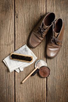 brown leather boots with shoe maintenance set