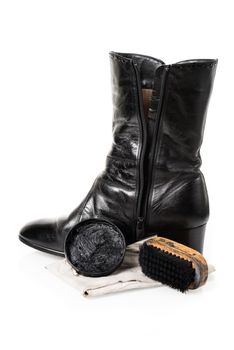 black leather boots with shoe maintenance set