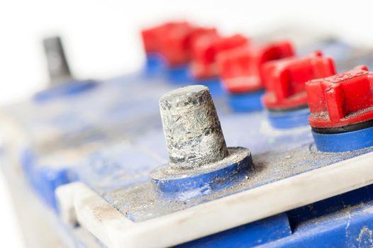 closeup old and dirty car battery isolated over white background