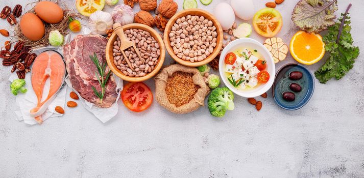 Ketogenic low carbs diet concept. Ingredients for healthy foods selection set up on white concrete background.