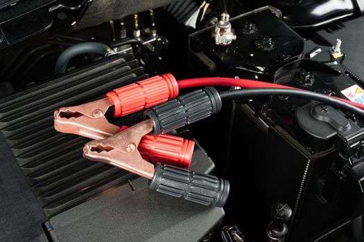 jumper cable for car battery in engine room, car repairing concept