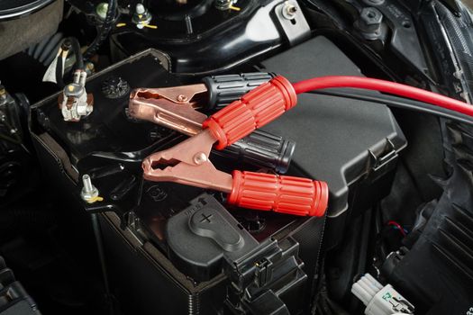 jumper cable for car battery in engine room, car repairing concept