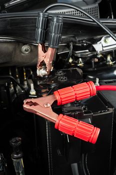 jumper cable for car battery in engine room, car repairing concept