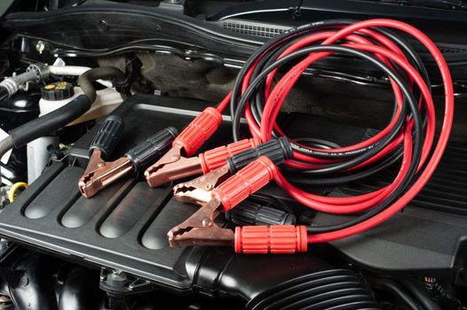 jumper cable for car battery in engine room, car repairing concept