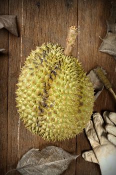 peeling Thai durian on wooden table