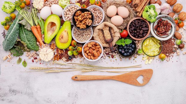 Ingredients for the healthy foods selection. The concept of superfoods set up on white shabby concrete background with copy space.