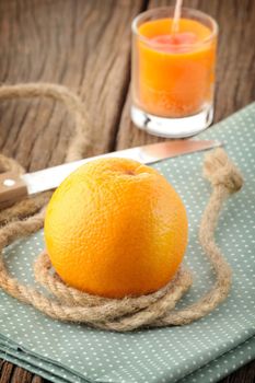 Ripe orange on wooden table