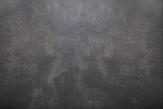 Background of old aged rough dark painted concrete with stains texture .Vintage dark concrete background top view.