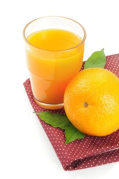 Ripe orange and cup of orange juice