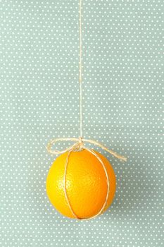 hanging ripe orange with rope