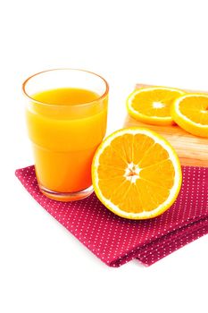 Ripe orange and cup of orange juice