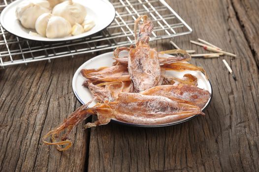 isolate dry squids on wooden desk