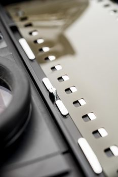 closeup film camera with film loaded on white background