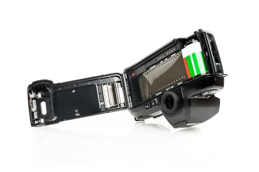 closeup film camera with film loaded on white background