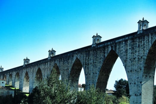 Beautiful stone aqueduct called Aguas Livres in Lisbon, Portugal.