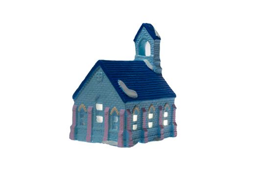 Children's small house on a white background.A gypsum product painted with acrylic paint in the form of a village house