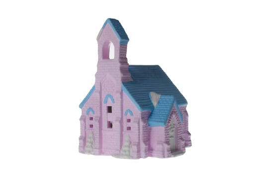 Children's small house on a white background.A gypsum product painted with acrylic paint in the form of a village house