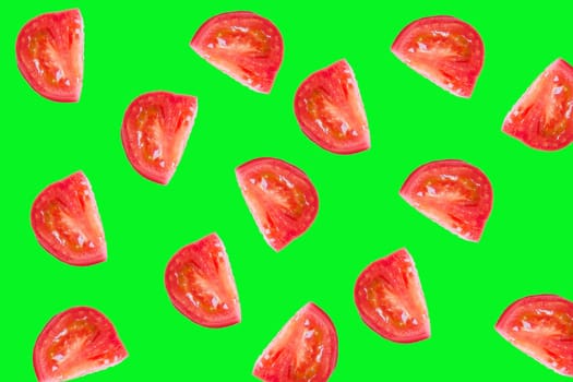 Slice the tomato on a bright green background