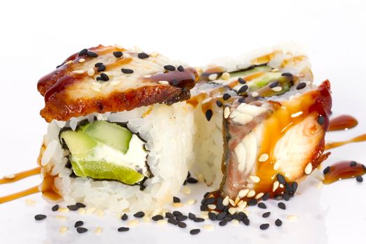 Sushi rolls japanese food isolated on white background.California Sushi roll with tuna, vegetables and unagi sauce closeup.Japanese Restaurant Menu.