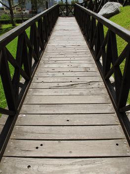 Hanging Wooden bridge in a forest along the trekki