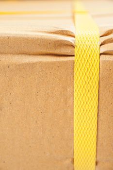 closeup detail of freight parcel with plastic strap