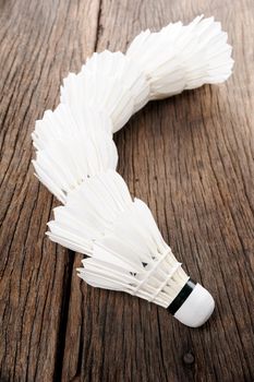 closeup shuttlecocks isolated on wooden table