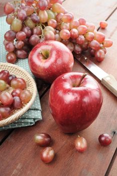 closeup ripe red apples and red grapes