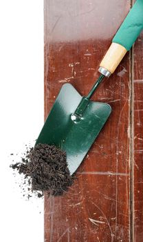 gardening tools on wooden plank background