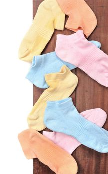 isolated old socks on wooden plank background