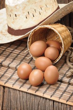 closeup group of fresh eggs on wooden plank