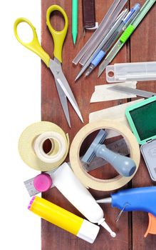 closeup many stationery on wooden plank, working background