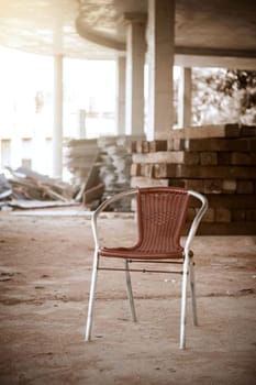 alone old brown chair in construction site