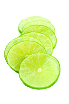 fresh green limes isolated on white background