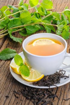 a cup of lemon tea with sliced lemon