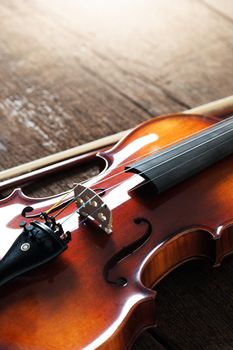 closeup new classical violin on wooden background