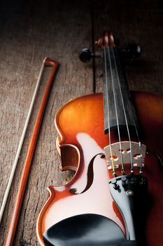 closeup new classical violin on wooden background