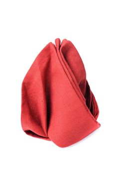 isolated folded red napkin over white background