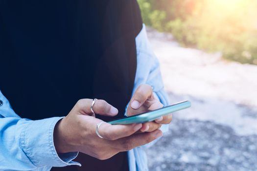 Woman hand using smartphone to do work business, social network, communication concept.