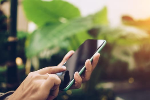 Woman hand using smartphone to do work business, social network, communication concept.