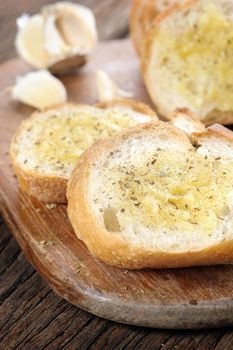 homemade garlic bread with herbs in the kitchen