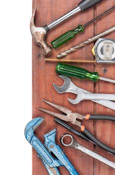 tools on wooden plank background